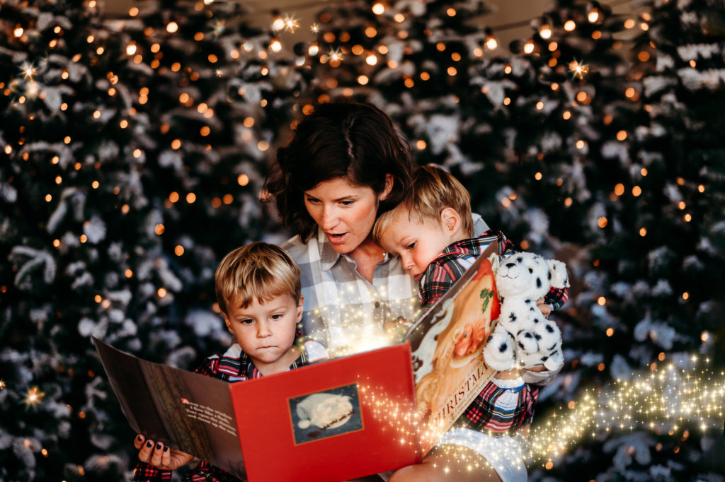 family reading Christmas magic book