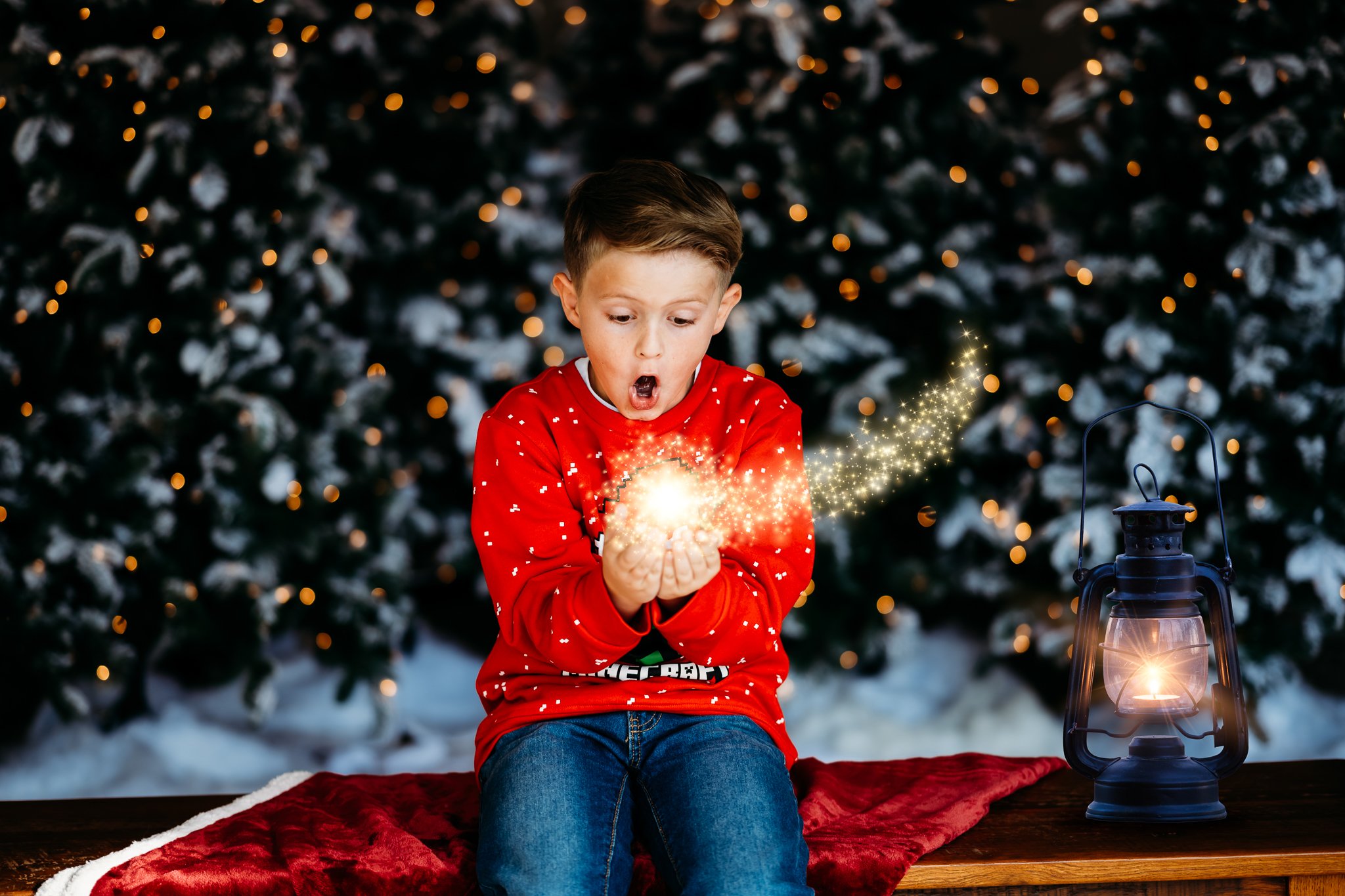 Christmas boy holding magical ball