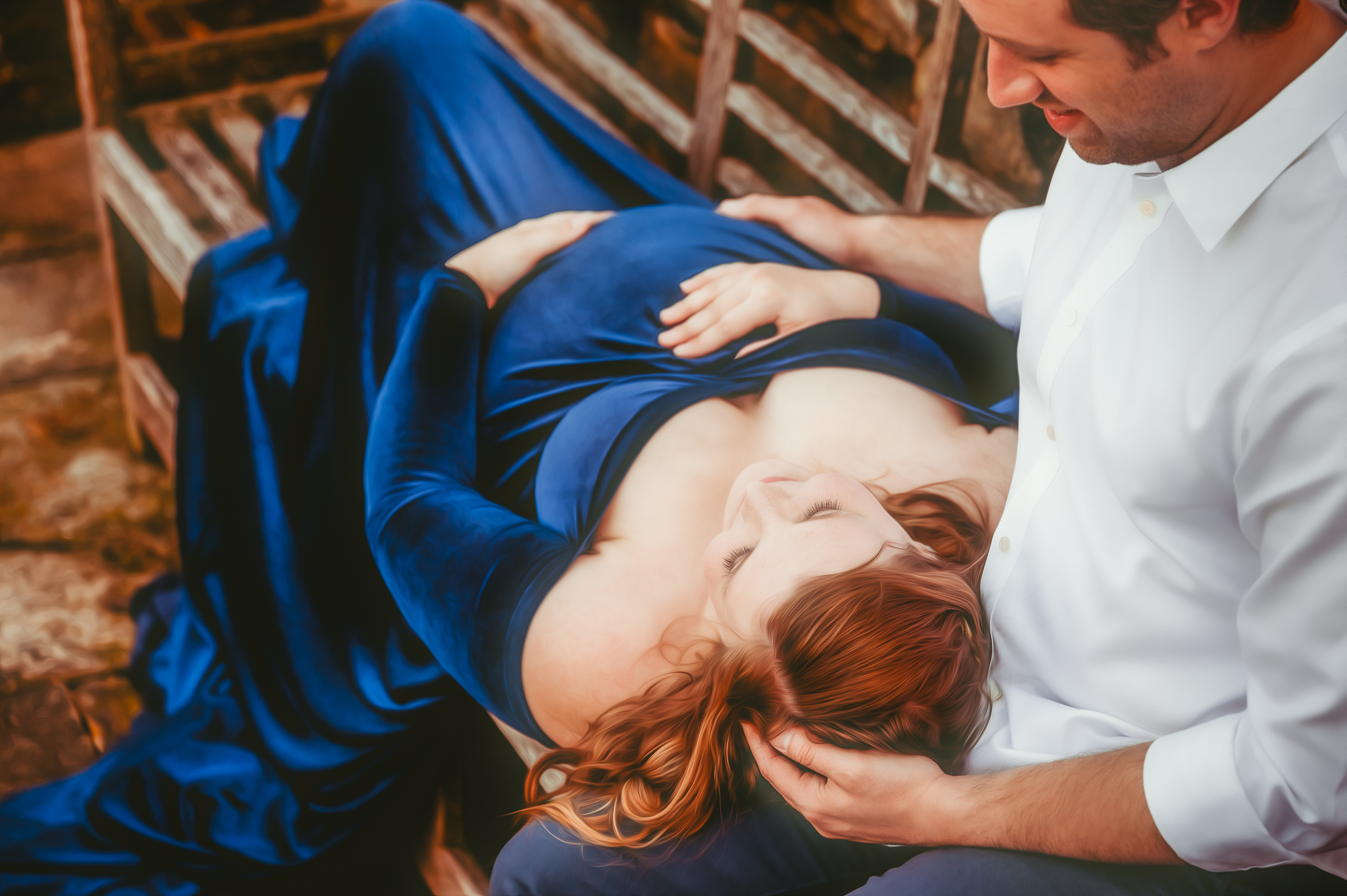Maternity pregnant woman lying on husbands lap