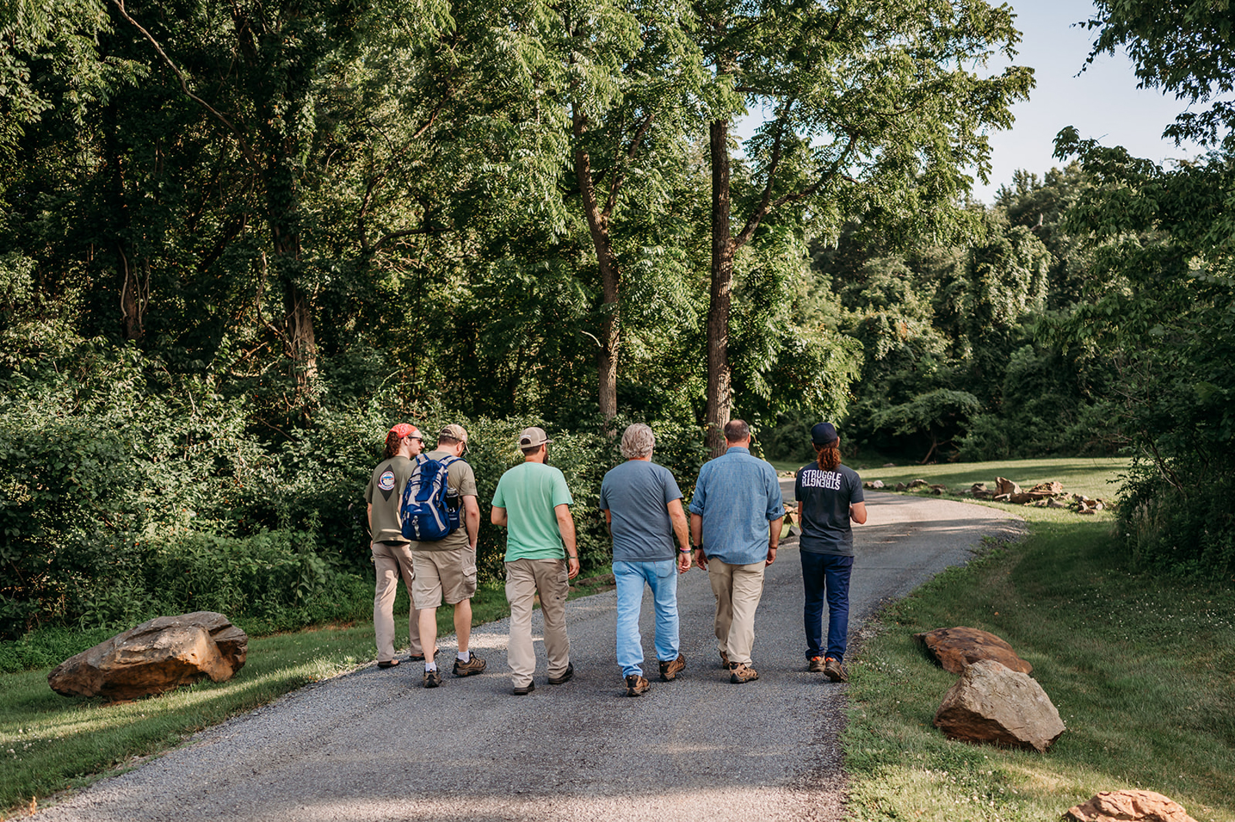Custom website photography for Boulder Crest by Jenny Sessoms. The team walking through the institute property